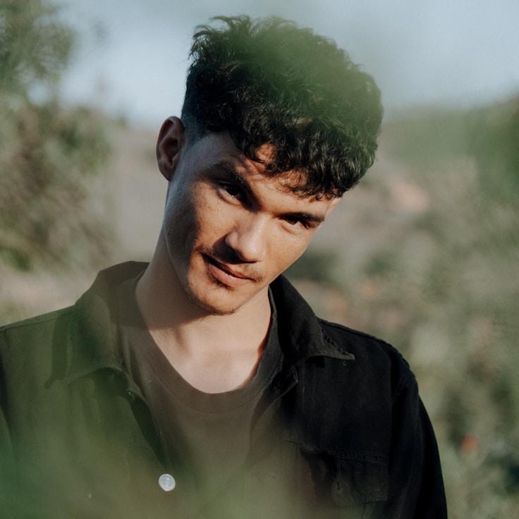 Kaveri Mehta, Lead Design Curator at Stream Brook Nook, reviewing corporate floral arrangements